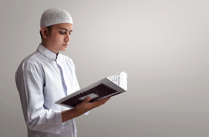 Muslim man reading koran